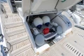 2023 Princess S62 yacht storage compartment with fenders and equipment on teak deck.