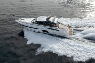 2016 Princess V58 Open yacht cruising on open water, creating a dynamic wake.