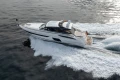 2016 Princess V58 Open yacht cruising on open water, creating a dynamic wake.