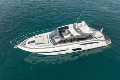 2016 Princess V58 Open yacht cruising on clear blue water.