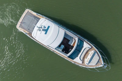 Aerial view of 2026 Princess V55 yacht on calm water.