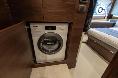 Washing machine in the cabin of Princess V55 yacht, year 2026.