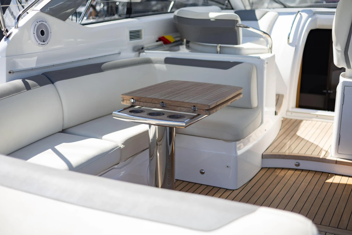 Luxurious 2019 Princess V40 yacht interior with elegant seating and wooden table.