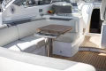 Luxurious 2019 Princess V40 yacht interior with elegant seating and wooden table.