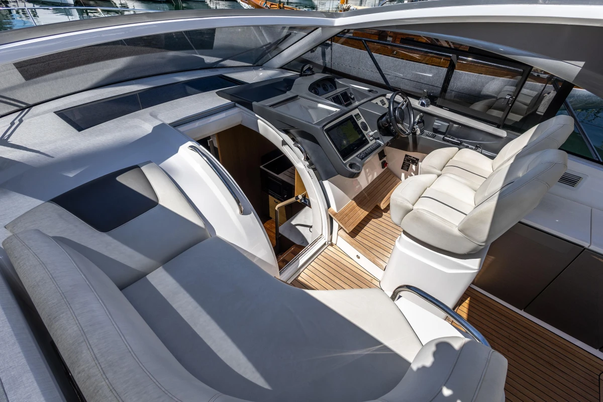 Interior of 2019 Princess V40 yacht with modern helm and luxurious seating.