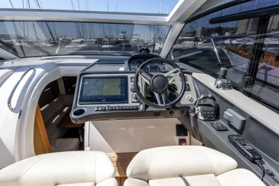 2019 Princess V40 yacht cockpit with modern navigation system and luxurious seating.