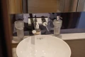 Modern bathroom sink with chrome fixtures on a 2019 Princess V40 yacht.