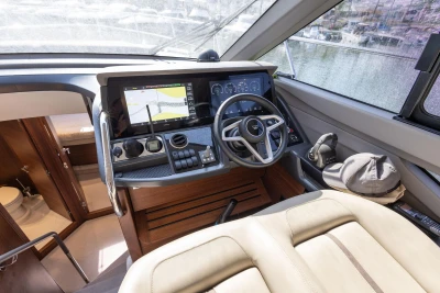 Luxurious 2024 Princess F50 yacht cockpit with advanced navigation system and plush seating.