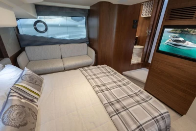 Luxurious 2024 Princess F50 yacht interior with cozy bedroom and modern amenities.