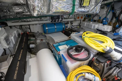 Engine room of 2024 Princess F50 yacht with equipment and wiring.