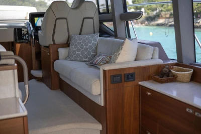 Luxurious interior of 2024 Princess F50 yacht with elegant seating and scenic view.