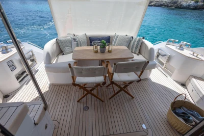 Luxurious 2024 Princess F50 yacht deck with elegant seating and ocean view.