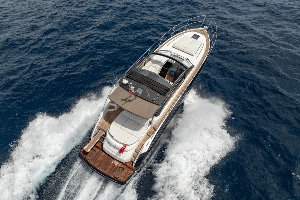 Aerial view of 2017 Princess V48 Open yacht cruising on the ocean.