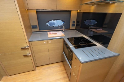 Modern kitchen in 2017 Princess V48 Open yacht with sleek countertops and appliances.