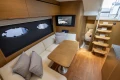 Luxurious interior of 2017 Princess V48 Open yacht with elegant seating and wooden finishes.