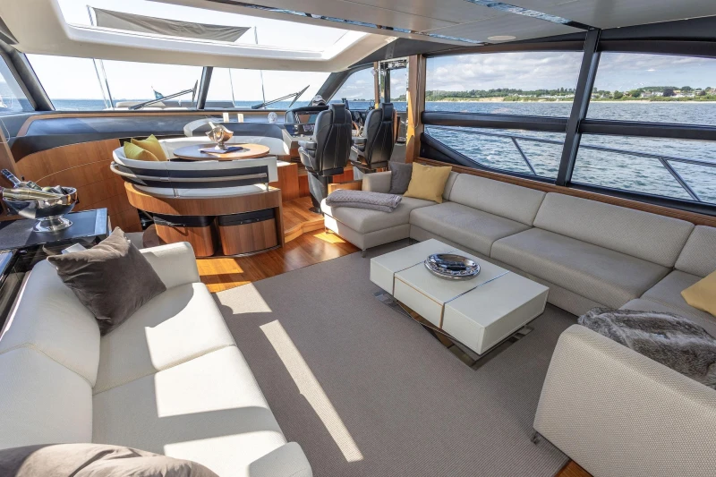 Luxurious interior of 2014 Princess S72 yacht with elegant seating and panoramic windows.
