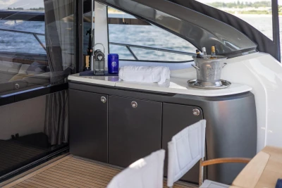 Luxurious 2014 Princess S72 yacht interior with elegant bar setup and ocean view.