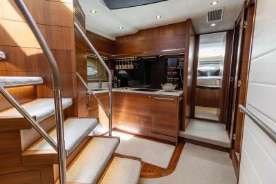 Luxurious interior of 2014 Princess S72 yacht with wooden cabinetry and modern amenities.