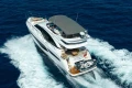 2023 Princess F55 yacht cruising on open sea, showcasing luxury design and spacious deck.
