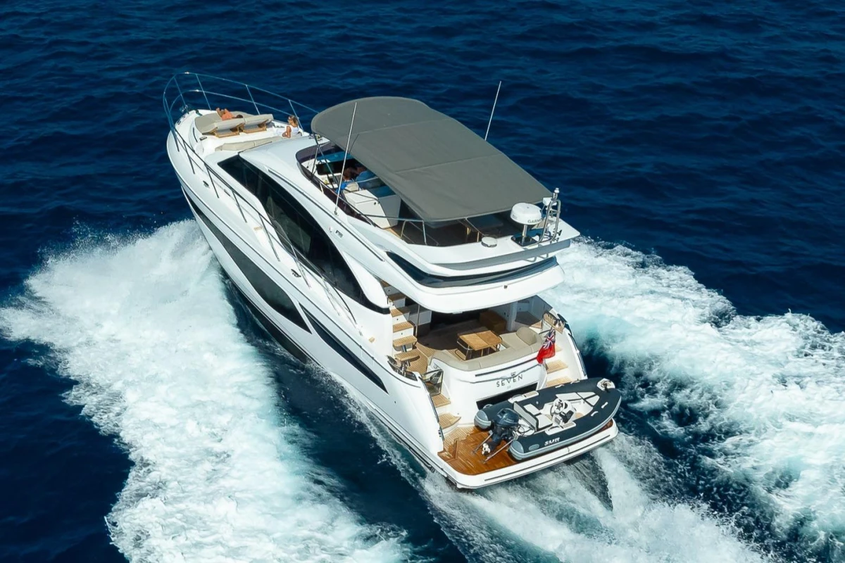 2023 Princess F55 yacht cruising on open sea, showcasing luxury design and spacious deck.
