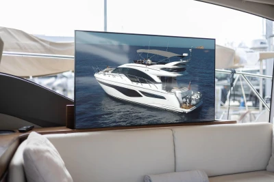Luxurious 2023 Princess F55 yacht displayed on a screen in a stylish boat interior.