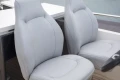 Luxurious seating on a 2014 Princess 56 yacht, featuring sleek, modern design.