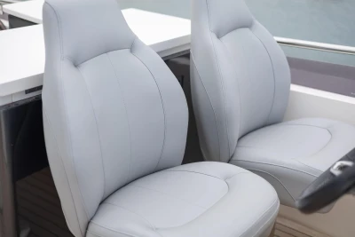 Luxurious seating on a 2014 Princess 56 yacht, featuring sleek, modern design.