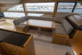 Luxurious interior of 2014 Princess 56 yacht with elegant seating and dining area.
