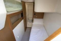 Compact cabin interior of 2014 Princess 56 yacht with bed and bathroom.
