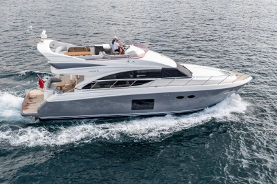 Luxury 2014 Princess 56 yacht cruising on open water.
