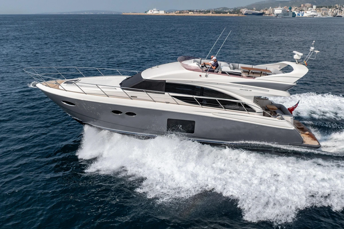 Luxury 2014 Princess 56 yacht cruising on open water.