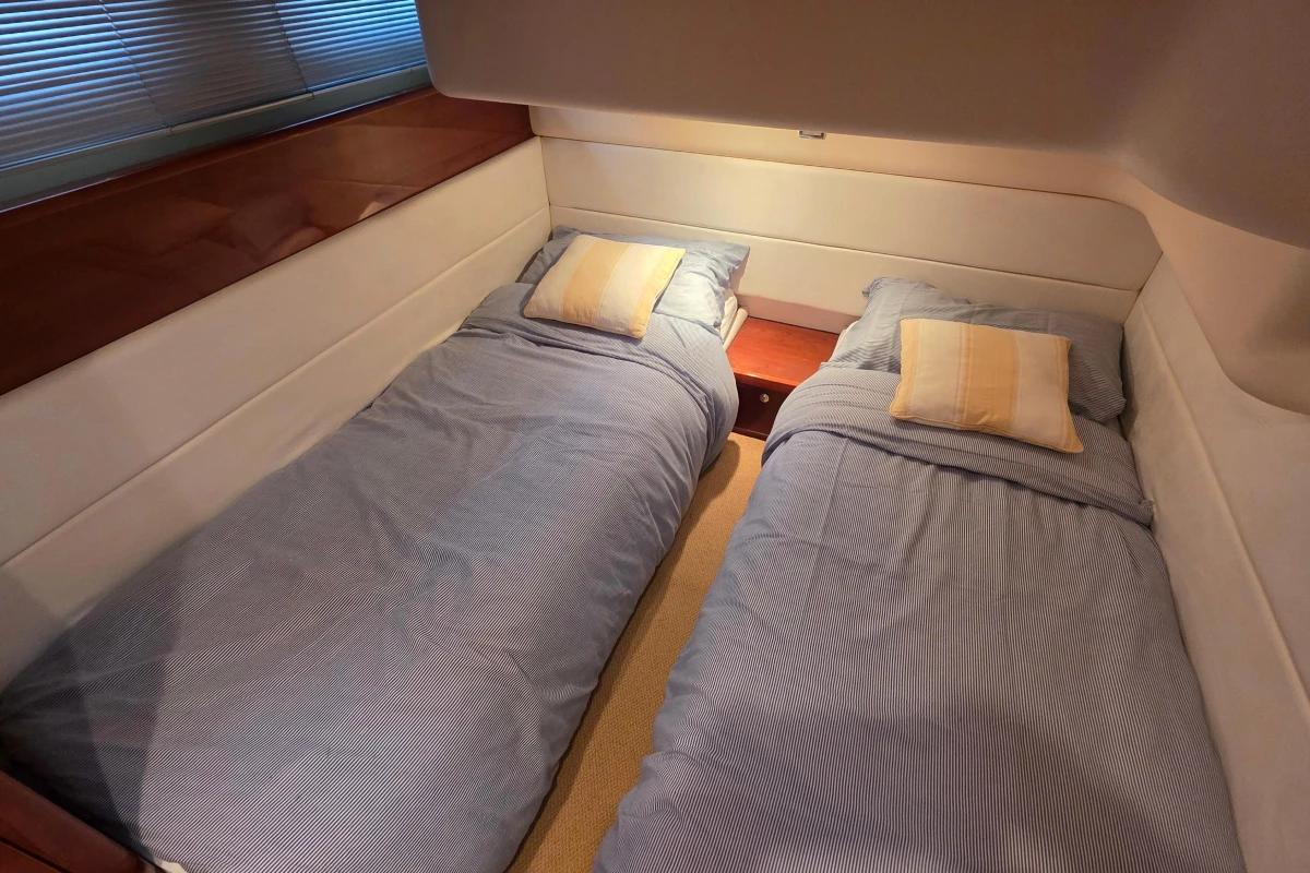 Twin beds in a 2006 Princess 42 Flybridge Motor Yacht cabin.