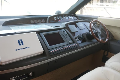 Helm of 2006 Princess 42 Flybridge Motor Yacht with navigation equipment and steering wheel.