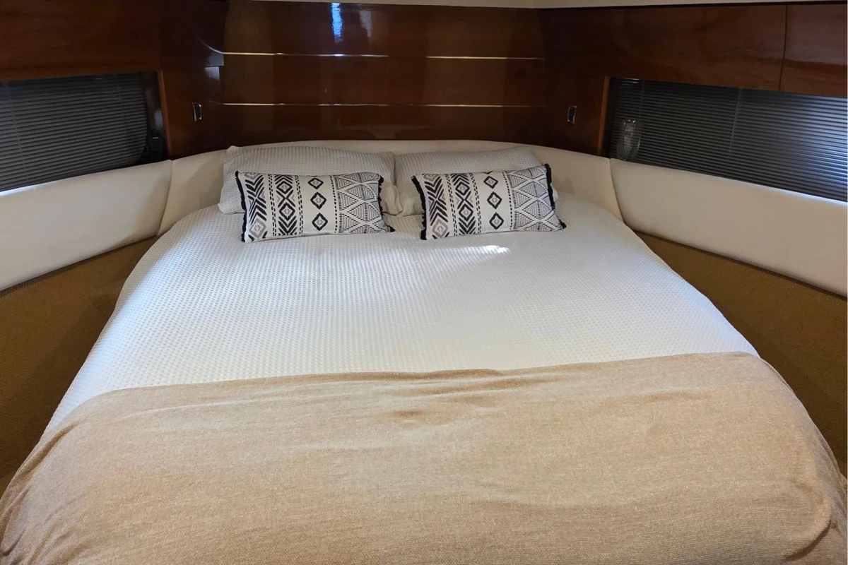 Luxurious bedroom interior of 2006 Princess 42 Flybridge Motor Yacht.