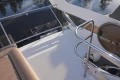 Flybridge view of 2006 Princess 42 Motor Yacht with railing and seating.