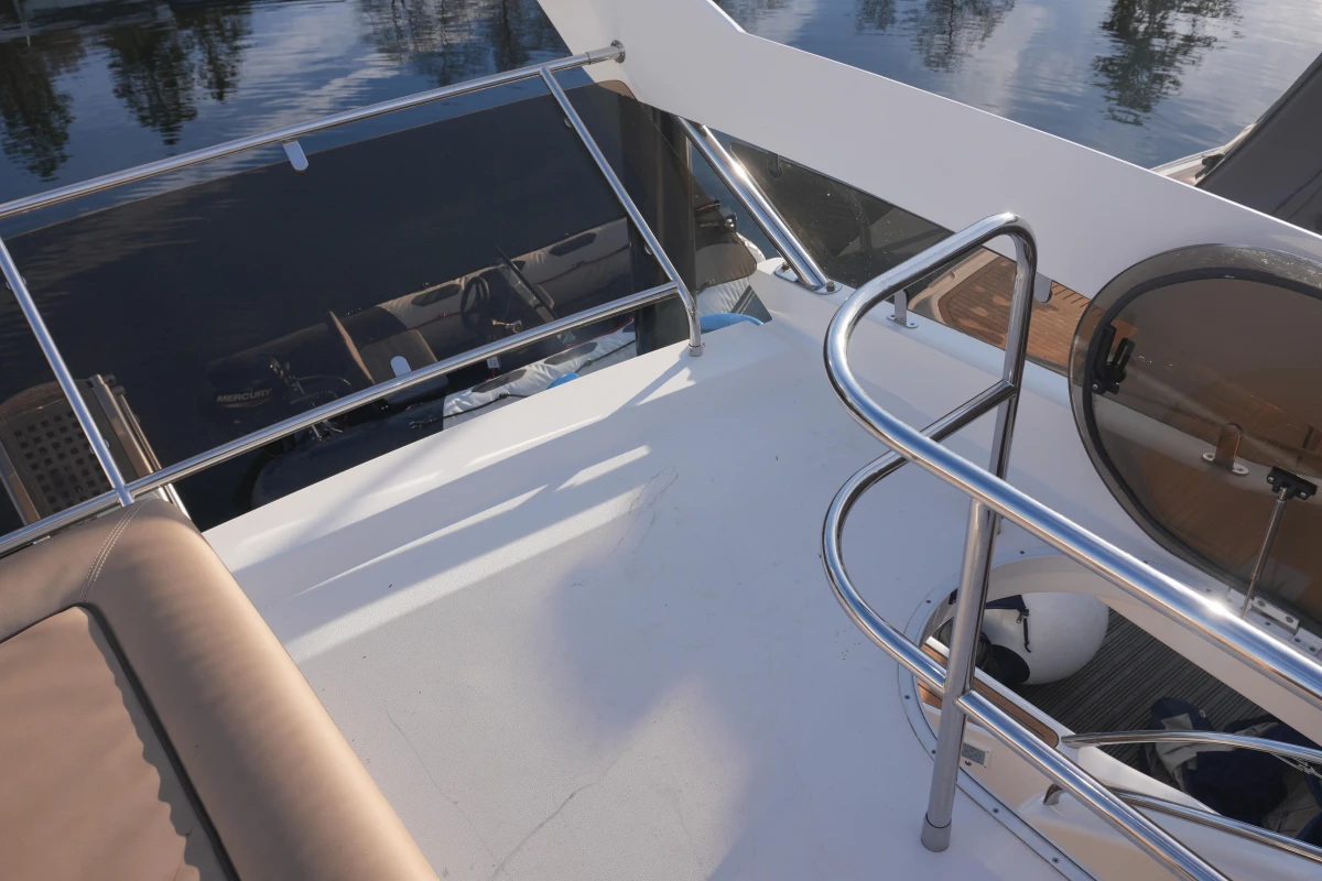 Flybridge view of 2006 Princess 42 Motor Yacht with railing and seating.