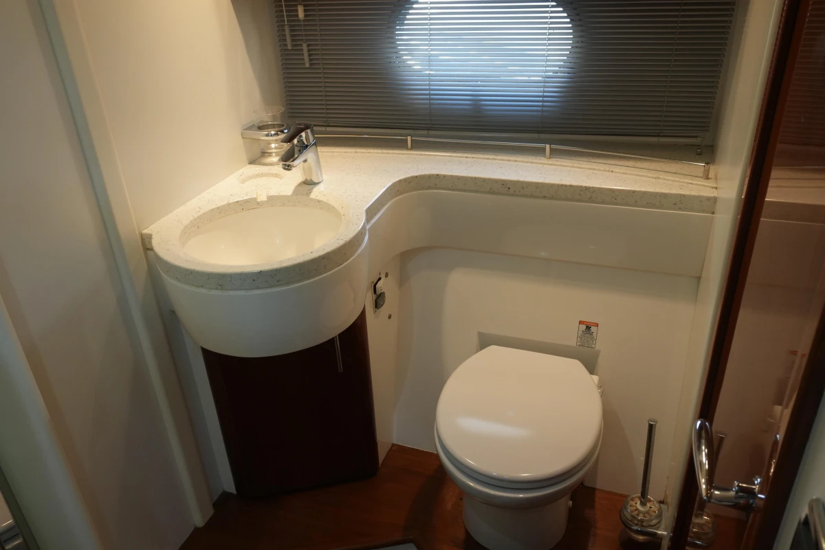 Bathroom interior of 2006 Princess 42 Flybridge Motor Yacht with sink and toilet.