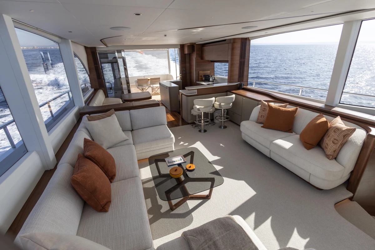 Luxurious interior of 2026 Princess Y72 yacht with ocean view and elegant seating.