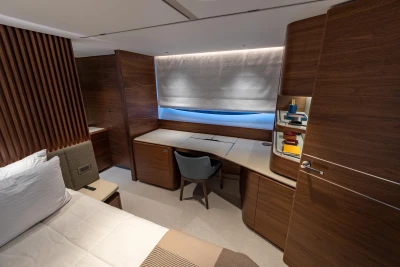 Luxurious cabin interior of 2026 Princess Y72 yacht, featuring elegant wood finishes and modern design.