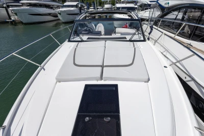 Luxury 2026 Princess V40 yacht docked at marina, showcasing sleek design and spacious deck.