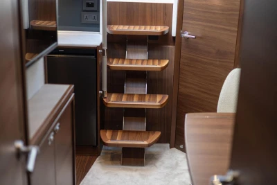 Interior of 2026 Princess V40 yacht featuring elegant wooden steps and modern design elements.