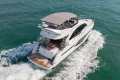 Luxury 2023 Princess F50 yacht cruising on open water.