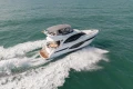 2023 Princess F50 yacht cruising on open sea, aerial view.