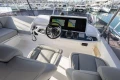 Luxury yacht helm with modern navigation system, Princess F50, 2023 model, docked at marina.