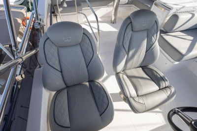 Luxury seating on 2023 Princess F50 yacht, featuring elegant gray upholstery and modern design.