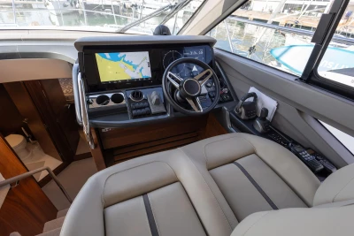2023 Princess F50 yacht helm with navigation display and luxurious seating.