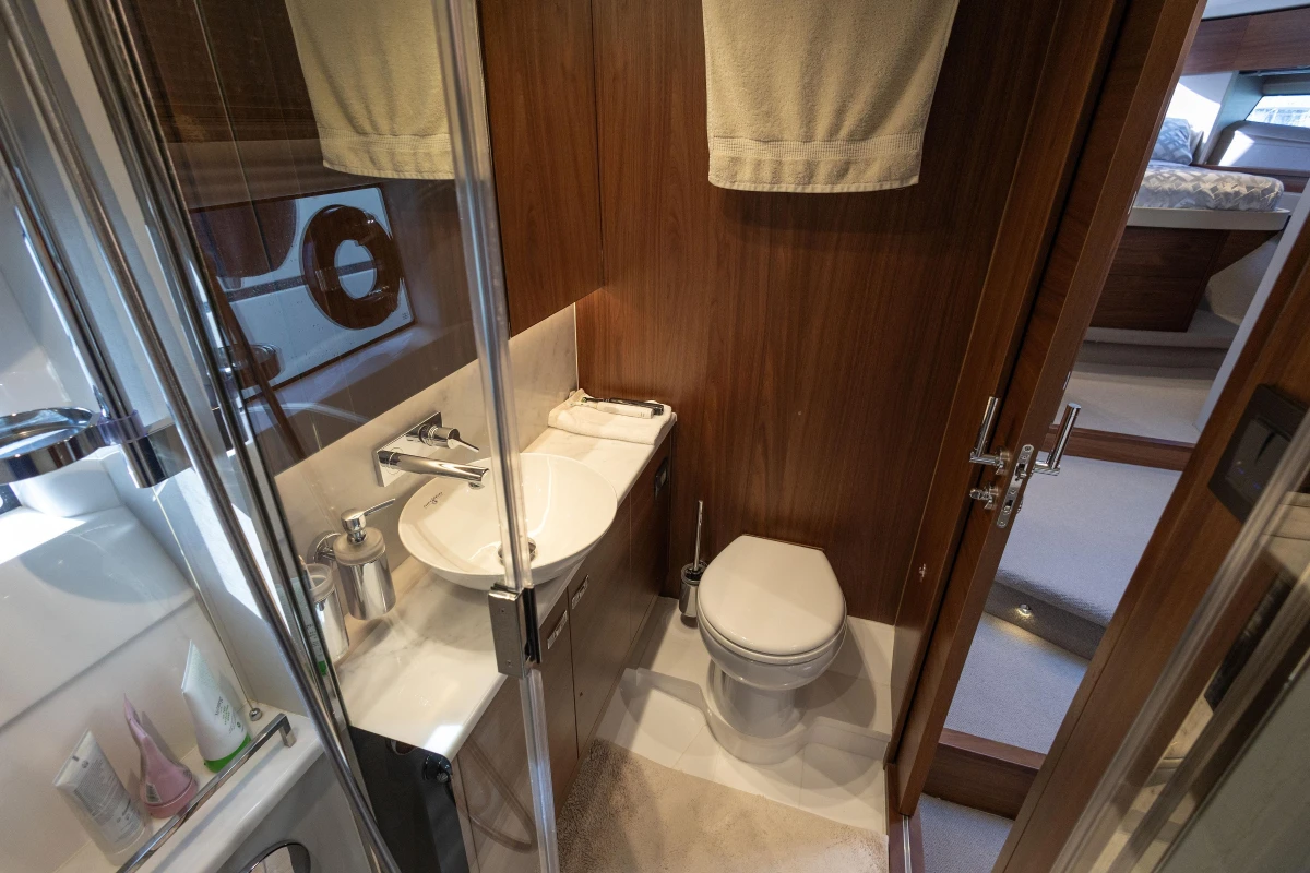 Luxurious bathroom in 2023 Princess F50 yacht with modern fixtures and wooden accents.
