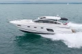 2014 Princess V52 yacht cruising on open water, showcasing sleek design and performance.
