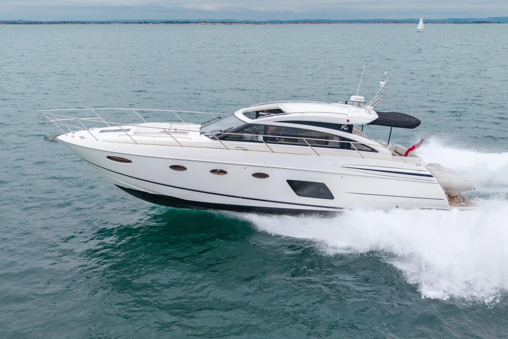 2014 Princess V52 yacht cruising on open water, showcasing sleek design and performance.