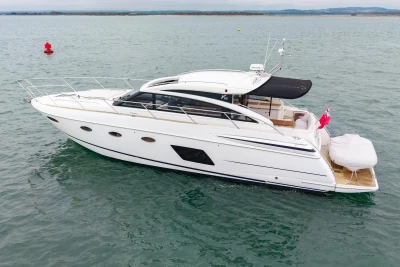 2014 Princess V52 yacht cruising on open water, side view.